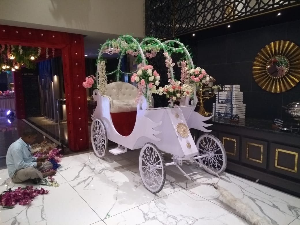 White floral horse carriage prop decorated with roses
