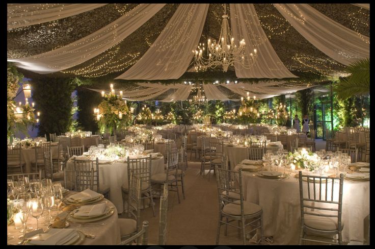 Romantic anniversary decoration in Delhi with candles, fairy lights, and rose petals creating an elegant setup for couples.