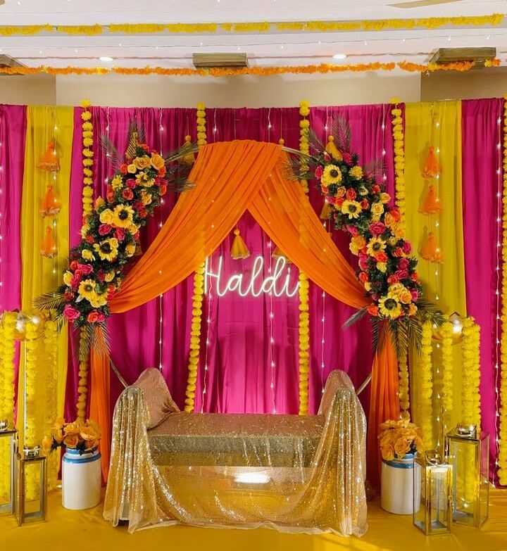 Traditional Haldi and Mehndi ceremony décor with vibrant flowers, turmeric rituals, and intricate henna designs creating a joyful pre-wedding celebration.