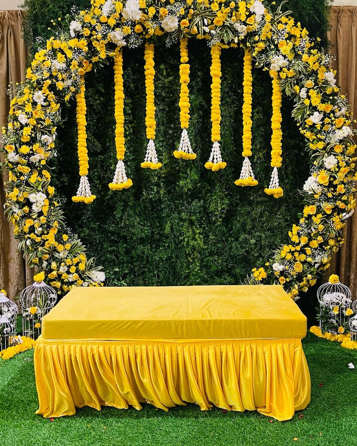 Traditional Haldi and Mehndi ceremony décor with vibrant flowers, turmeric rituals, and intricate henna designs creating a joyful pre-wedding celebration.